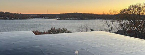 Waterproof membrane sheet on flat surface overlooking horizon 
