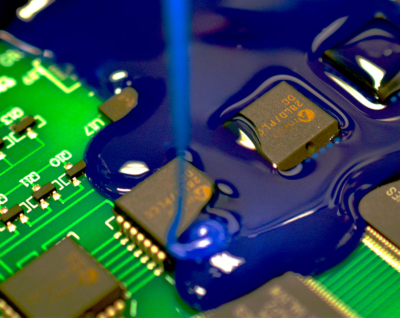 image of thermal coating being added t o a circuit board