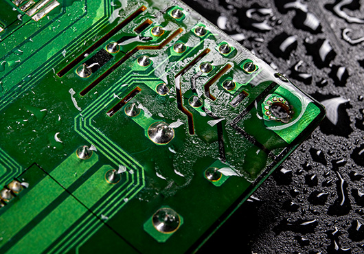 image of a circuit board with water drops